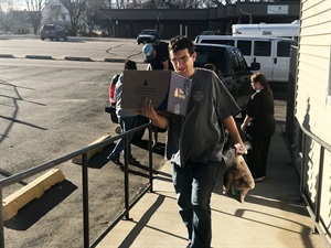 Employees Delivering Donation